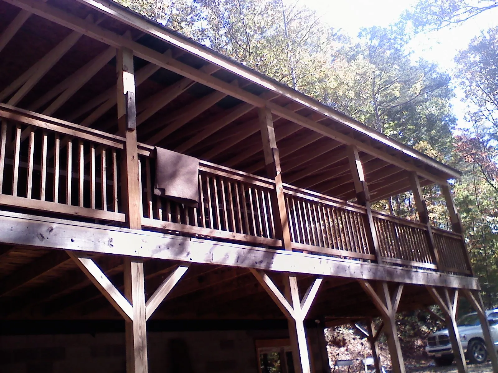Timber framing under a new elevated porch and deck — Roof Leak Repair in South Walpole by Roofing Brothers